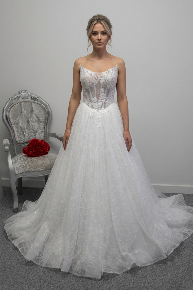 Woman wearing the wedding dress with a bridal updo