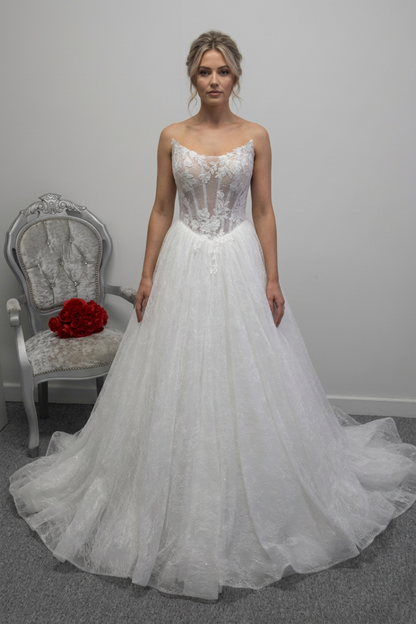 Woman wearing the wedding dress with a bridal updo